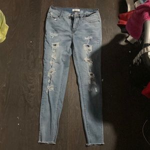 Light blue jeans, size 13. with rips.